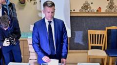 Hungarians vote in big numbers on whether to end Orbán rule and elect rival